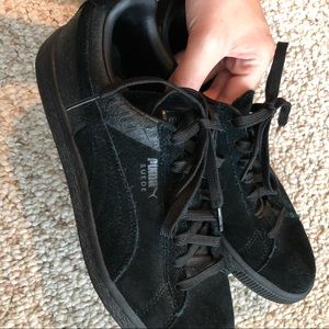 All black suede pumas